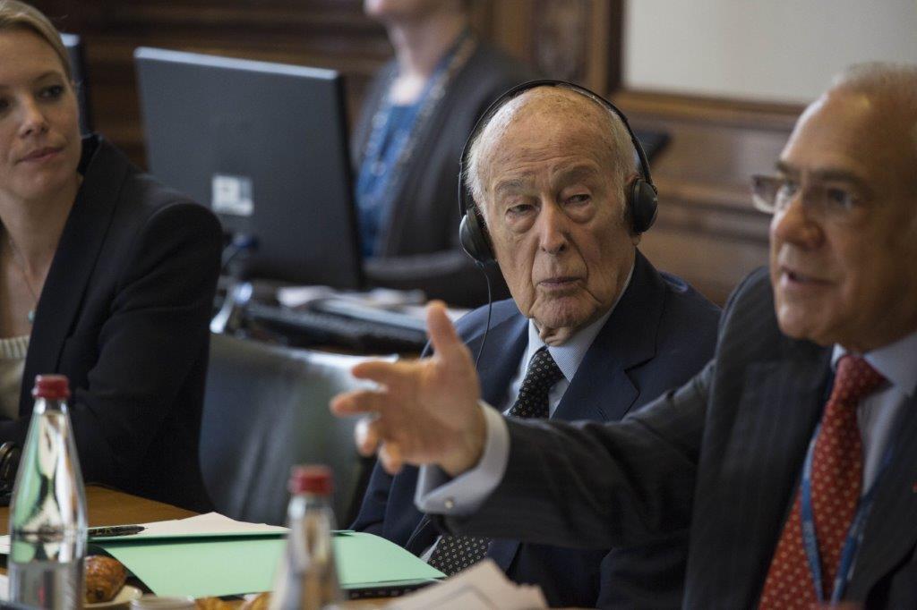 Giscard d'Estaing listening to a speech