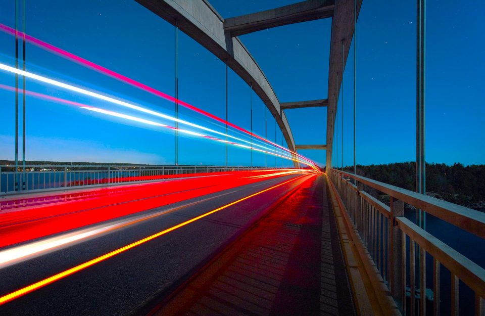 Conceptual Photo of a bridge with lights in fast motion going through