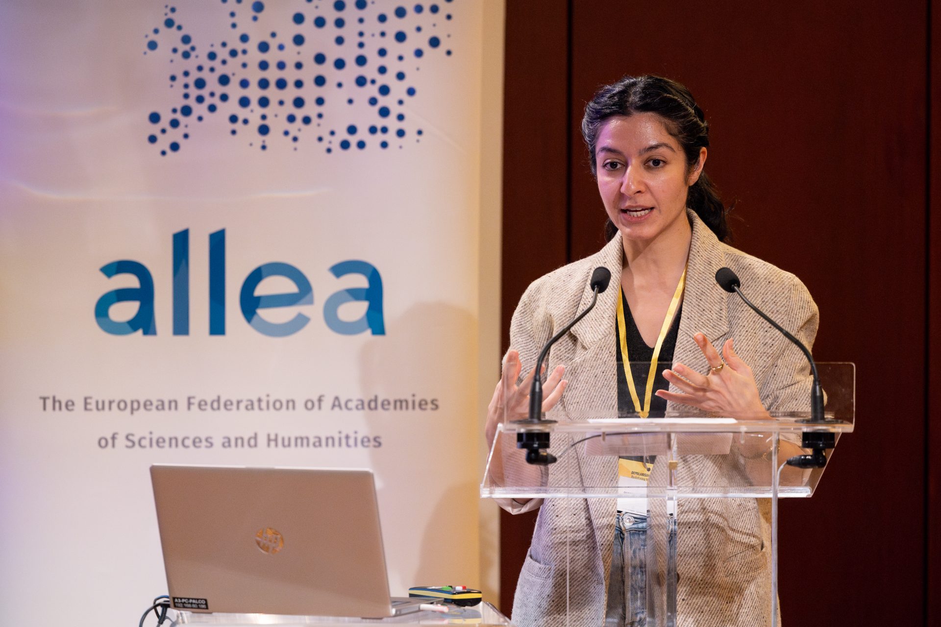 Dr. Donya Alinejad delivering a presentation at the RIE/ALLEA workshop in Lisbon